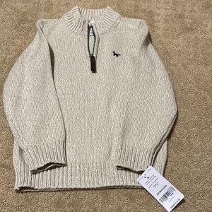 NWT.  Boys size 4T pull over sweater by Carter’s